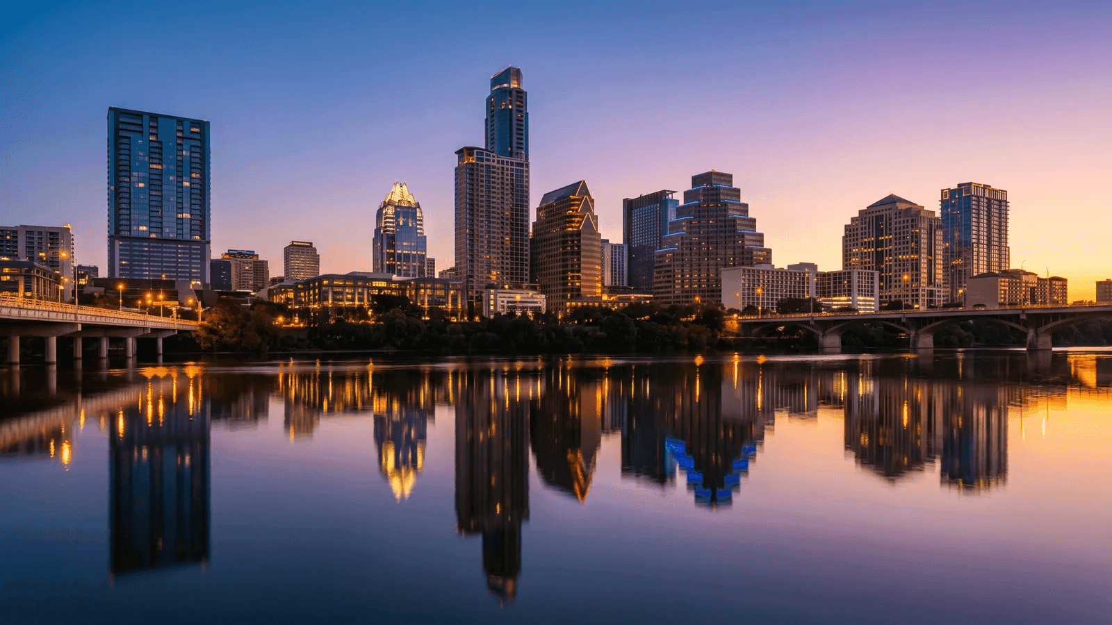 Downtown Austin, Texas skyline at dusk reflected in the Colorado River